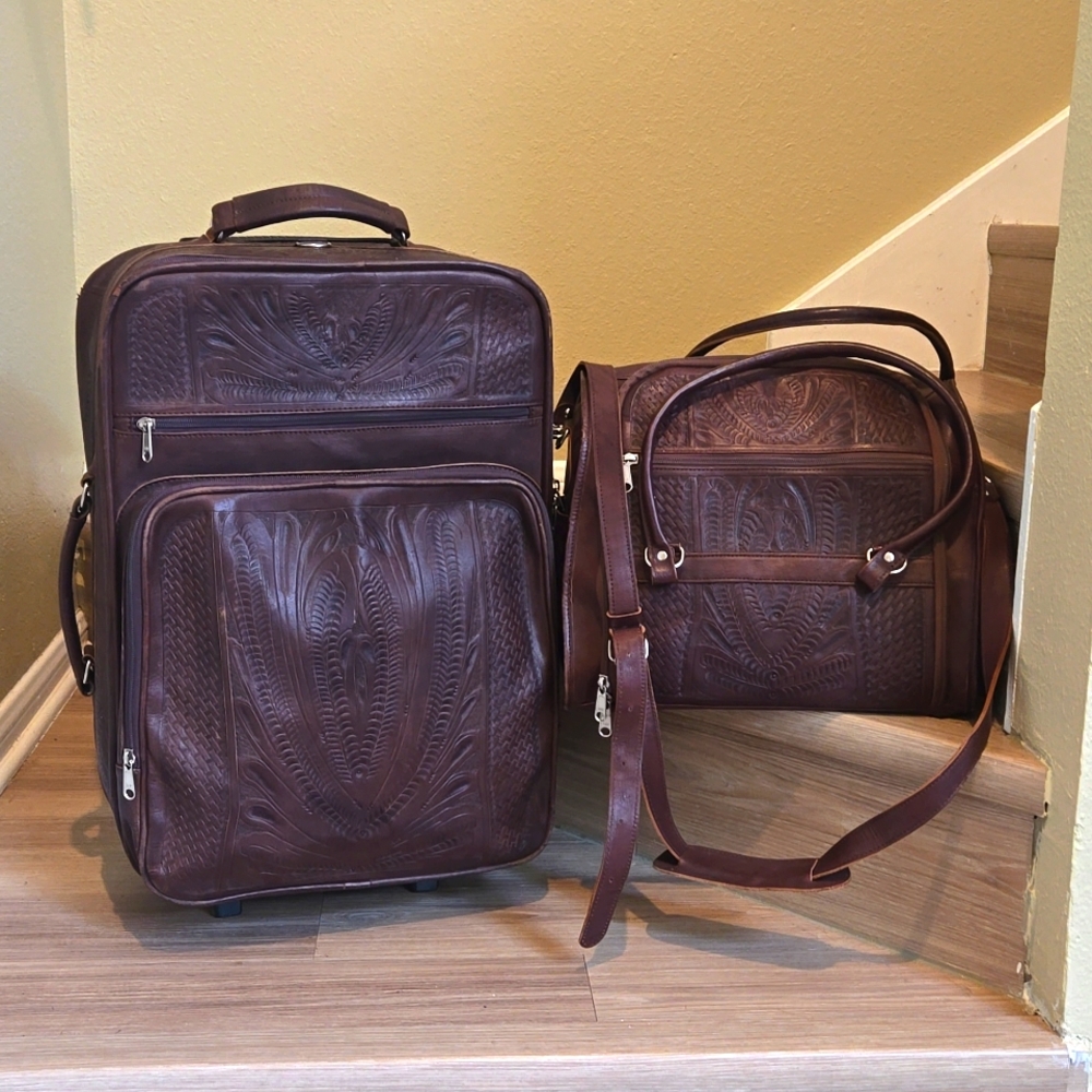 TOOLED LEATHER ROLLER SUITCASE AND TOILETRY BAG
